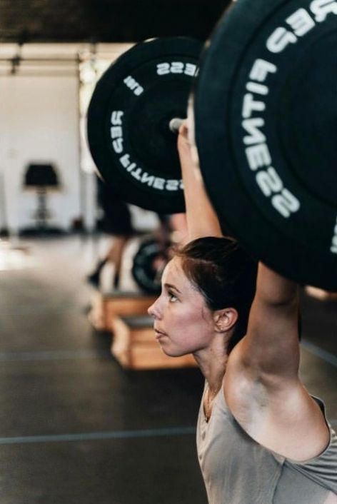 Trainer leading HIIT class